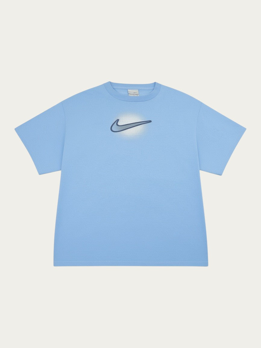 Camiseta Nike vintage de los 90 en color azul claro con logo central, de Alabama Vintage